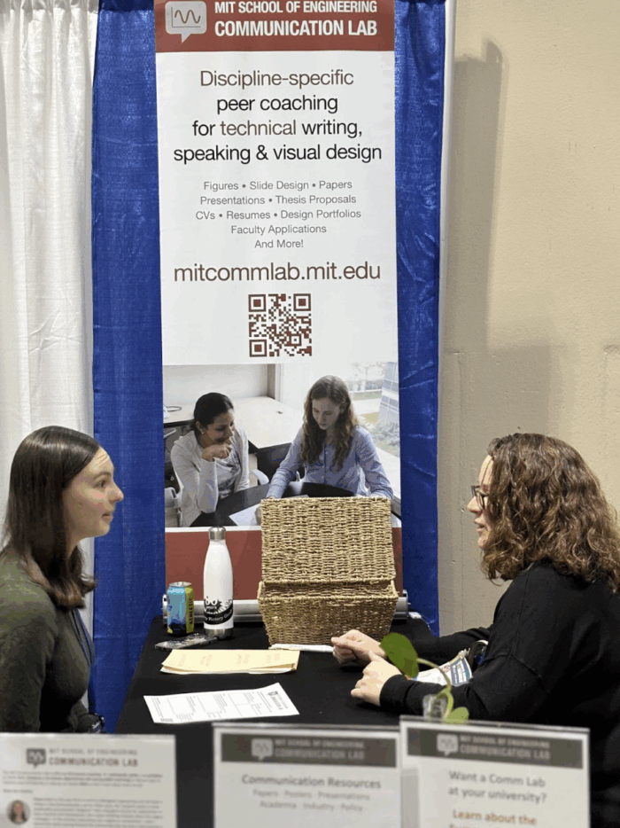 Comm Lab Fellow Kasey Love coaches a client at the AAAS25 booth.